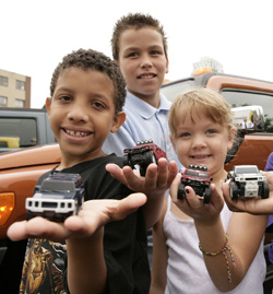 Kids with their Happy Meal HUMMER trucks