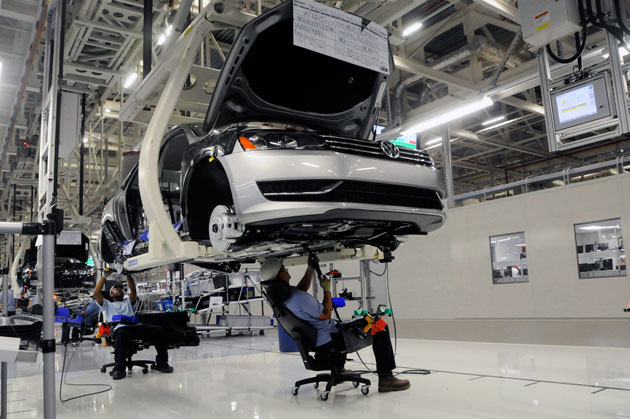 Worker assembling 2012 Volkswagen Passat