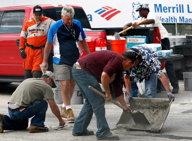 Workers pouring concrete at the 2012 Detroit Belle Isle Grand Prix