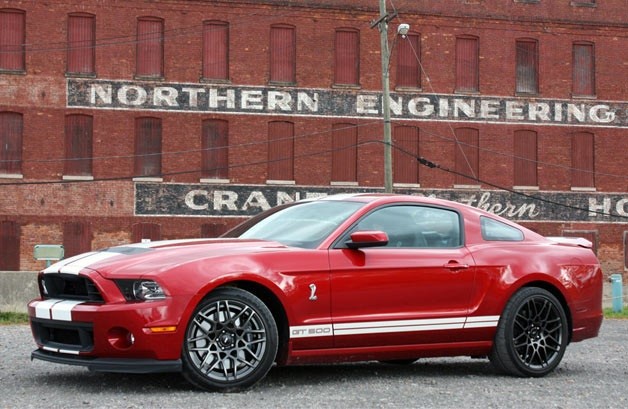 2013 Ford Shelby GT500 coupe in red candy metallic - front three-quarter view