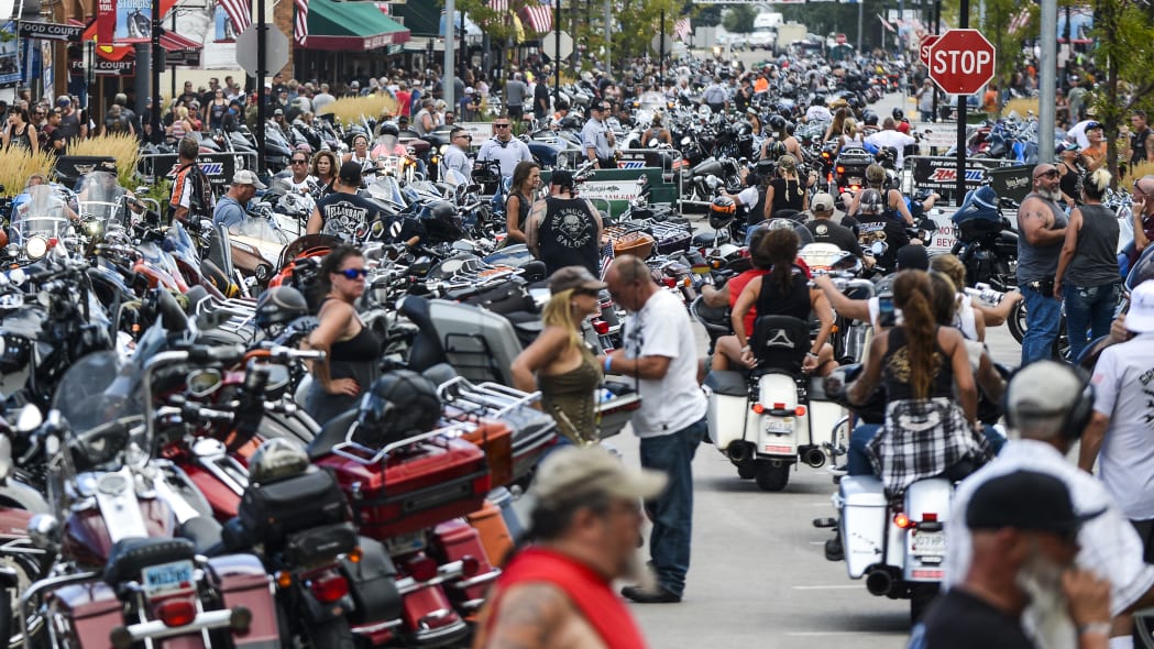 STURGIS, SD - AUGUST 07: Motorcycles and people crowd Main Street during the 80th Annual Sturgis Motorcycle Rally on August 7, 2020 in Sturgis, South Dakota. While the rally usually attracts around 500,000 people, officials estimate that more than 250,000 people may still show up to this year's festival despite the coronavirus pandemic. (Photo by Michael Ciaglo/Getty Images)