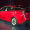 2016 Toyota Prius red, at reveal event, rear 3/4