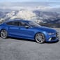 blue audi rs7 sportback performance in the mountains
