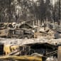 PHOENIX, OR - SEPTEMBER 10: Damaged homes and cars are seen in a mobile home park destroyed by fire on September 10, 2020 in Phoenix, Oregon. Hundreds of homes in the town have been lost due to wildfire. (Photo by David Ryder/Getty Images)