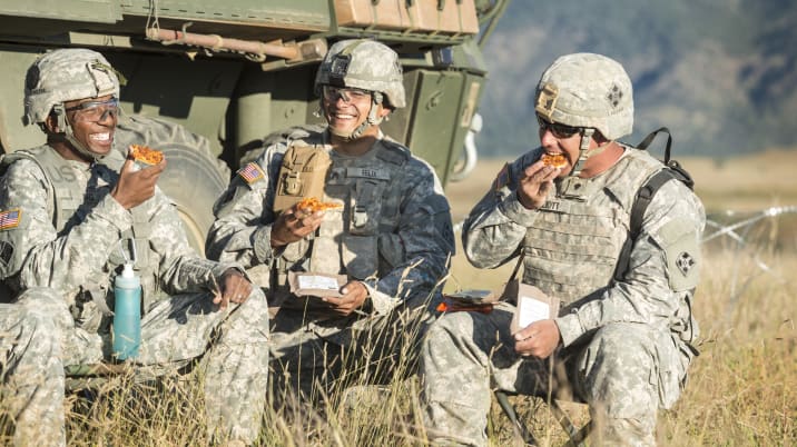 US Army soldiers eating pizza MREs