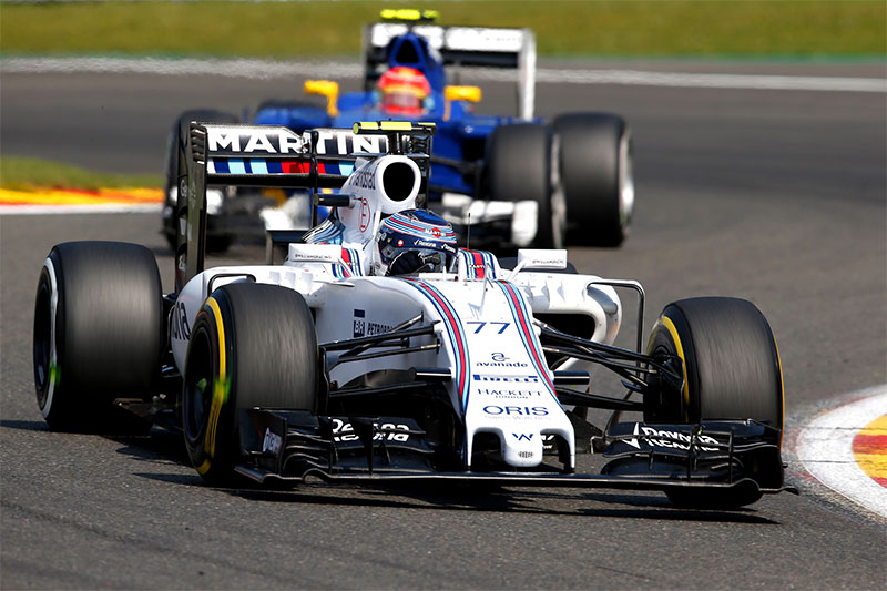 Valtteri Bottas drives during the 2015 Belgian Grand Prix with mismatched tires.