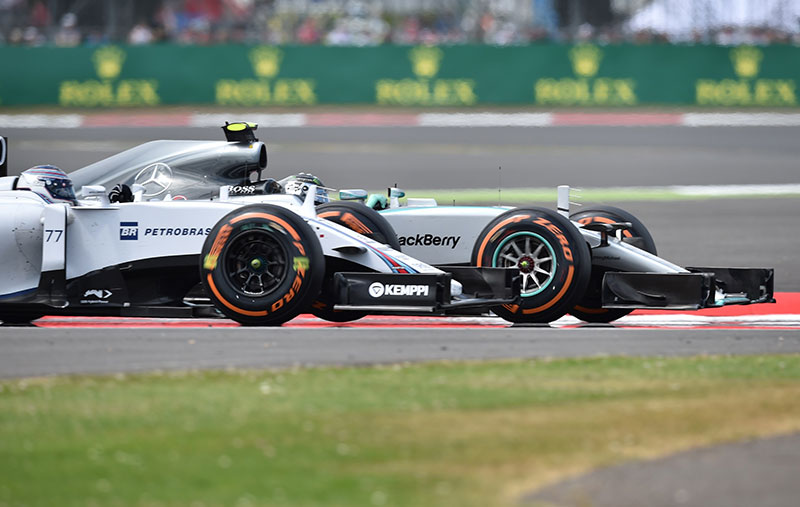 Nico Rosberg passes Valtteri Bottas at the 2015 British Grand Prix.