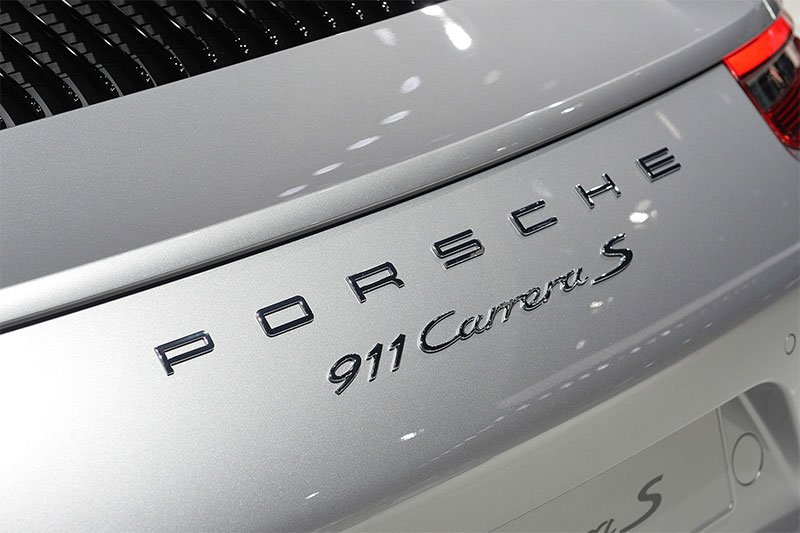 The badge on the hood cover of the 2016 Porsche 911.