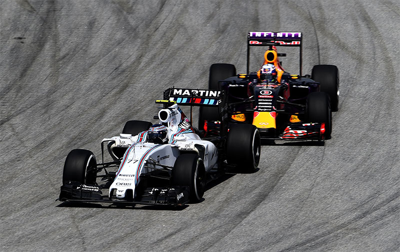 Williams races Red Bull at the 2015 Malaysian F1 Grand Prix.