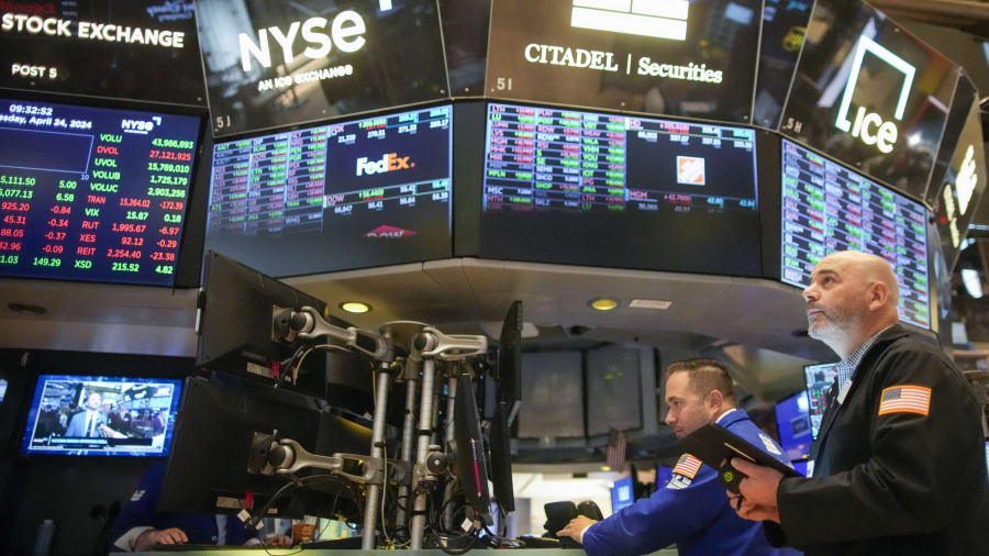 Wall Street slips after dispiriting data on the economy, as Meta sinks