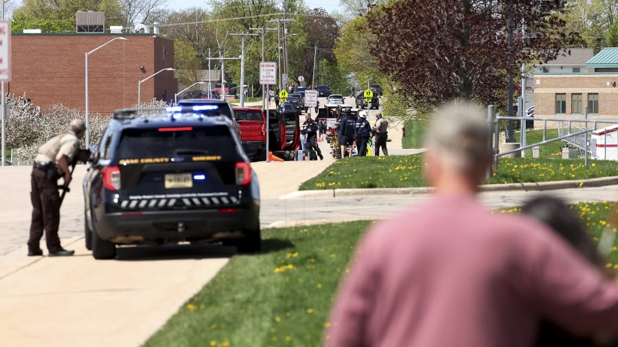Investigators say student killed by police outside Wisconsin school had pointed pellet rifle