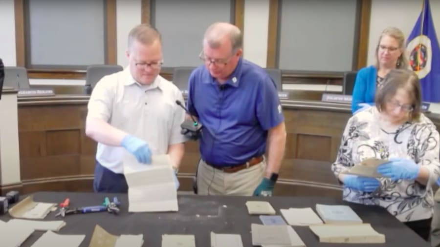 High school official discovers century-old time capsule during demolition of old building