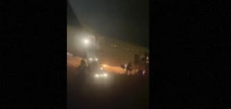 Boeing 737 catches fire and skids off the runway at a Senegal airport. Ten people are injured