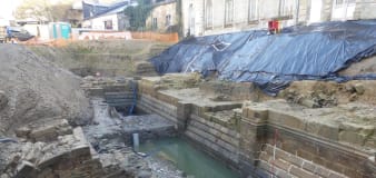 Hotel excavation reveals medieval castle with moat