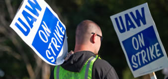 Striking autoworkers want to end a system that pays different wages for the same job