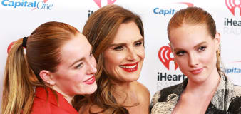 Brooke Shields says adult daughters sleep in the bed with her when husband is away