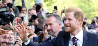 Prince Harry beams as fans line streets after King Charles reunion fail