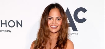 Chrissy Teigen Jokes What She Would Have Worn to Met But 'Wasn't Invited'
