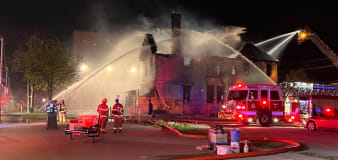 Flames ravage Windsor's abandoned 'rainbow house' on Ouellette in overnight fire