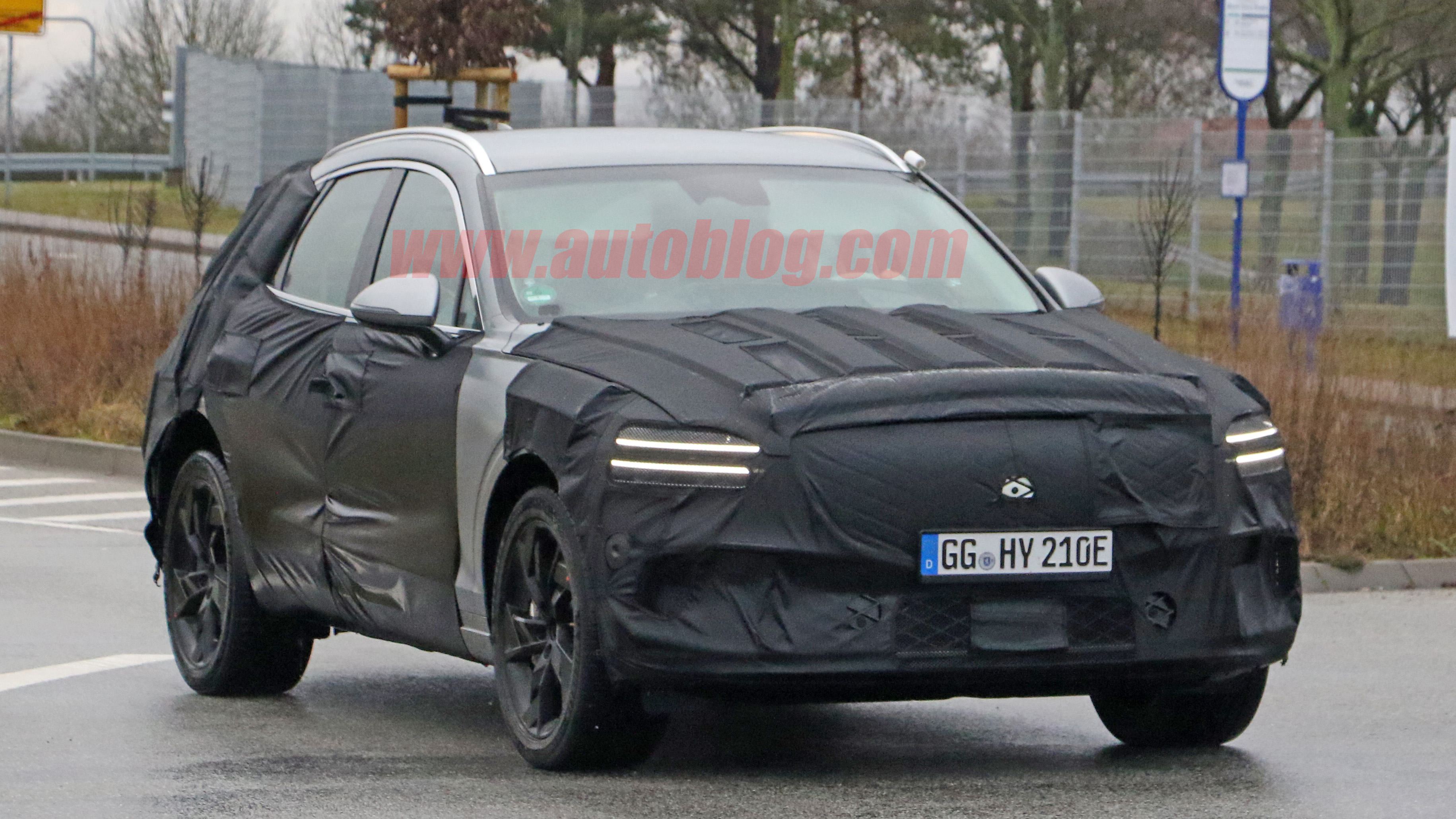 Genesis GV70e spied out testing for the first time - Autoblog