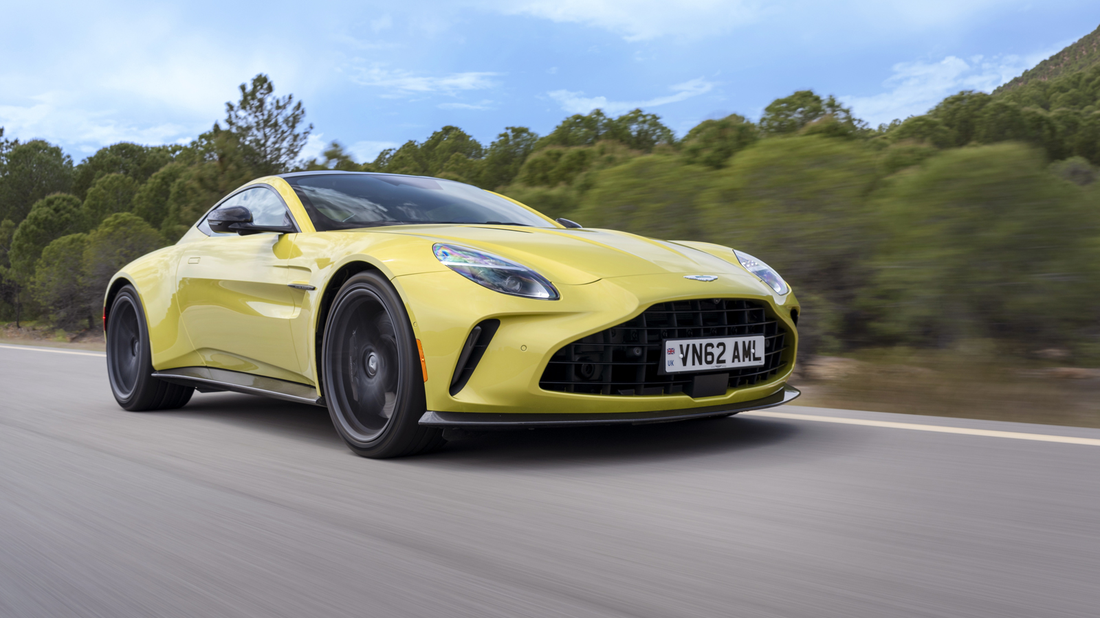 2025 Aston Martin Vantage in Cosmopolitan Yellow action front three quarter